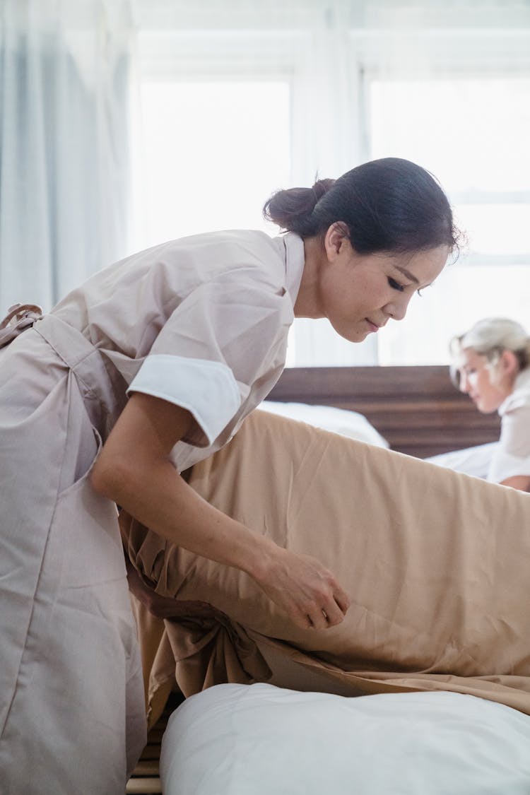 Cleaning Ladies Making The Bed