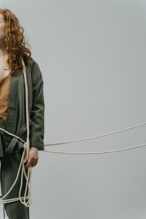 Free Creative studio shot of a woman with ropes, offering conceptual copy space Stock Photo