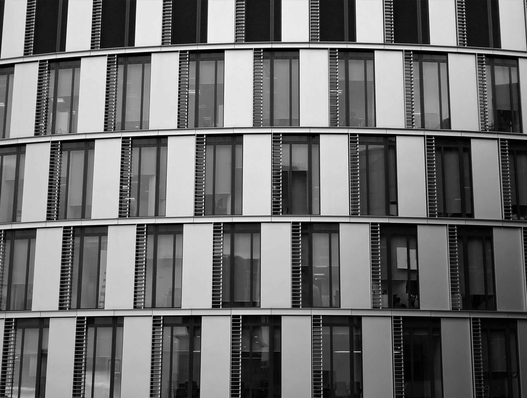 Low-angle view of a Lucent commercial building facade