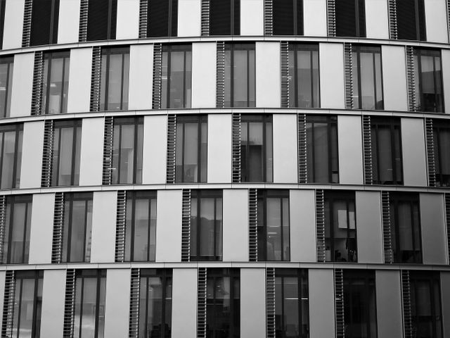 Glass-and-steel exterior of a contemporary office building — photo by SevenStorm JUHASZIMRUS on Pexels