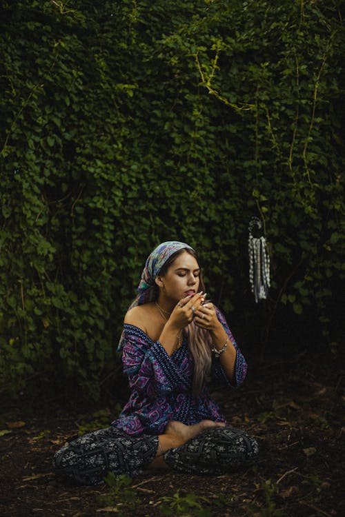 Woman Meditating in Yard