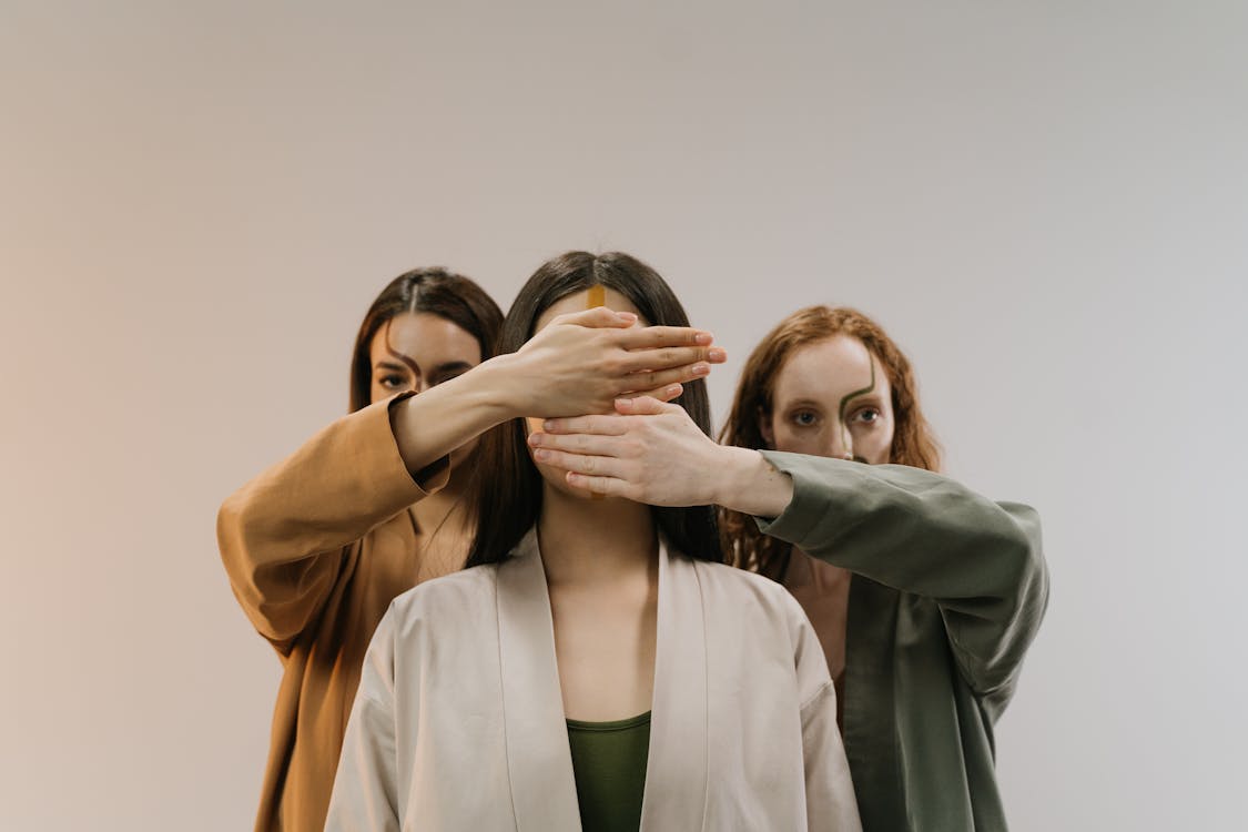 Free Woman in Brown Blazer Covering Her Face With Her Hands Stock Photo