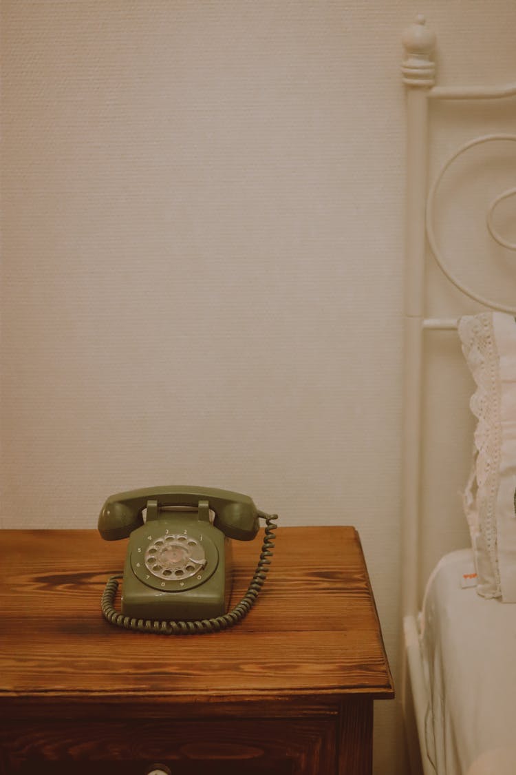 Vintage Corded Phone On Bedside Table