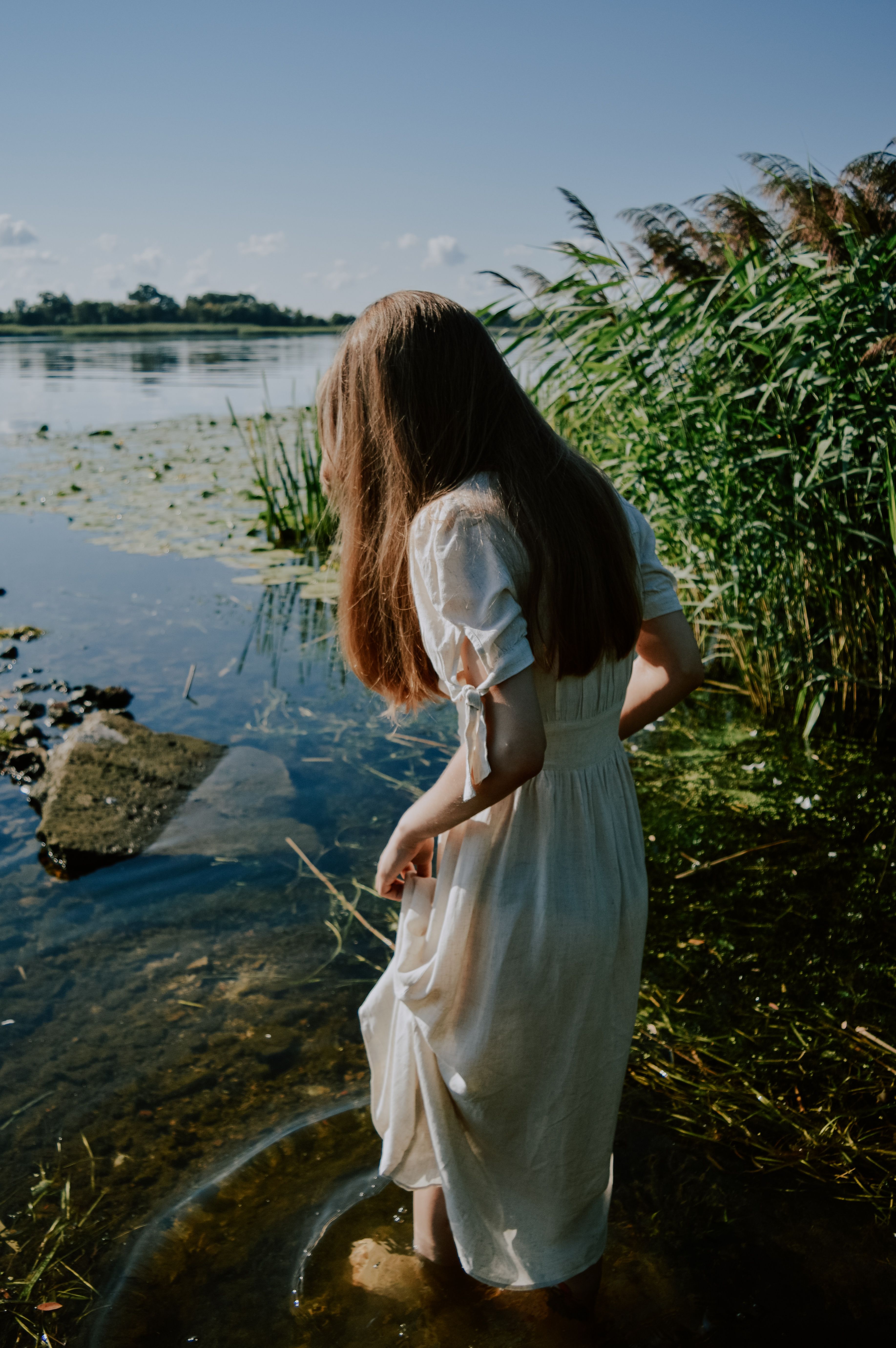 A Woman in White Dress Standing on the Lake · Free Stock Photo
