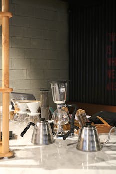 A sophisticated display of coffee brewing equipment on a marble counter, perfect for cafes.