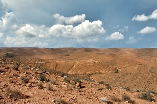 Free Expansive desert scene in Souss-Massa, Morocco with blue sky and clouds. Stock Photo