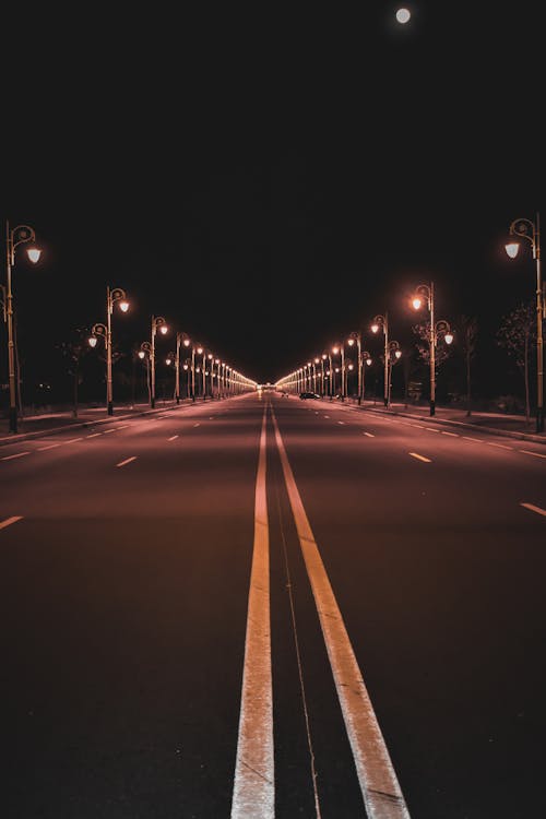 An Empty Road During Night Time