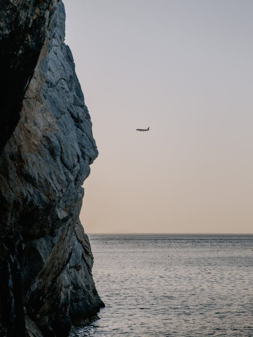 Airplane Flying Over the Ocean