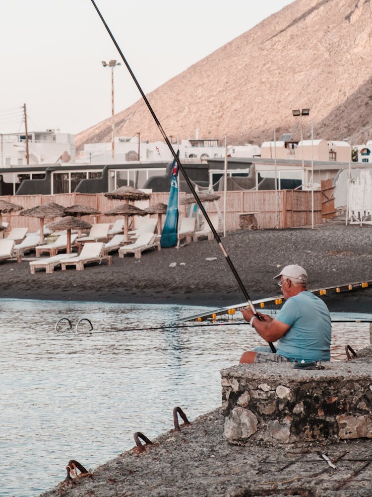 Fisherman Fishing In Sea