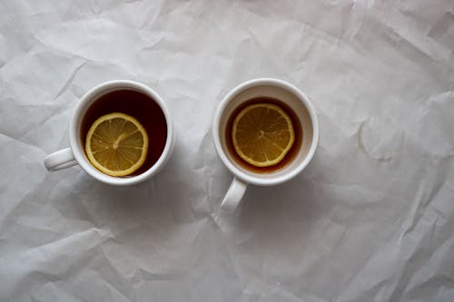 Foto stok gratis irisan lemon, kertas putih, mug