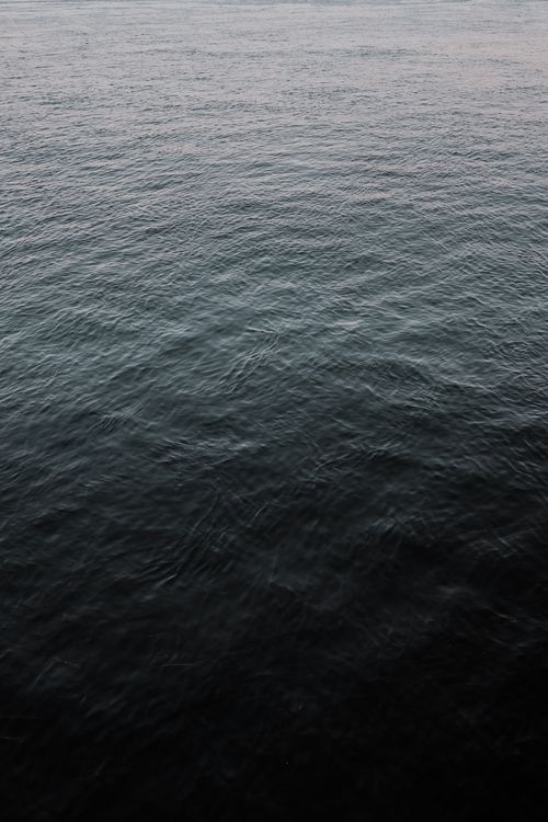 Free A tranquil view of a water surface with gentle ripples, creating a calming effect. Stock Photo