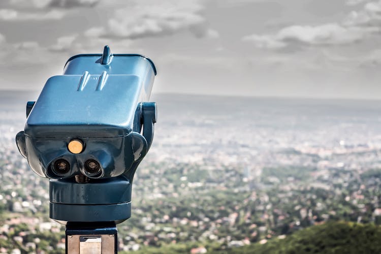 Blue Coin Operated Binocular With City View During Daytime