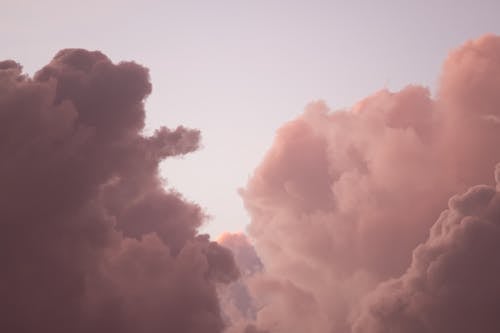 Fluffy Purple and Dark Clouds in the Sunset Light