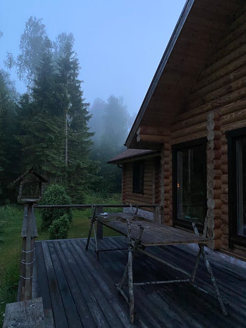 Brown Wooden House Near Green Trees