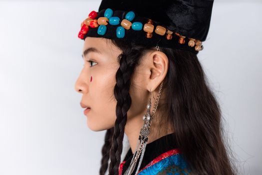 Woman in Black and Red Shirt Wearing Silver Earrings