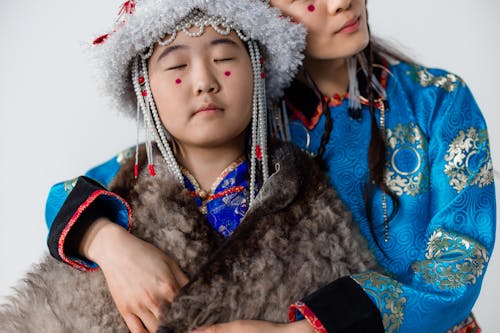 A Girl in Traditional Clothes with Her Eyes Closed