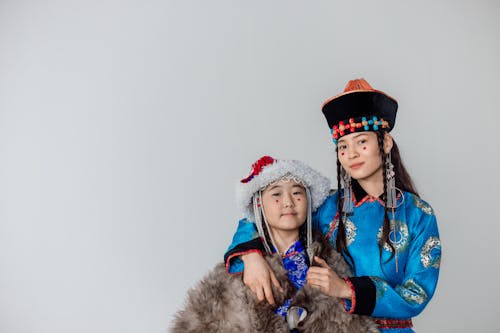 A Mother and Daughter in Traditional Clothes