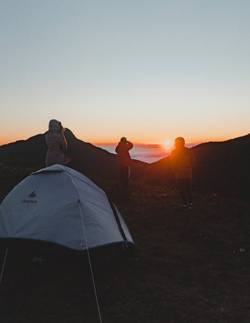 Campers Looking at the Sunrise