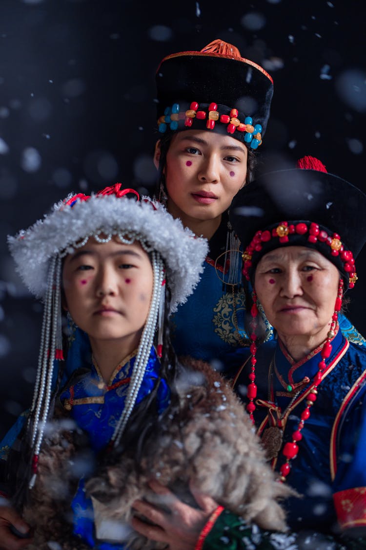 A Family Wearing Traditional Clothes Posing Together