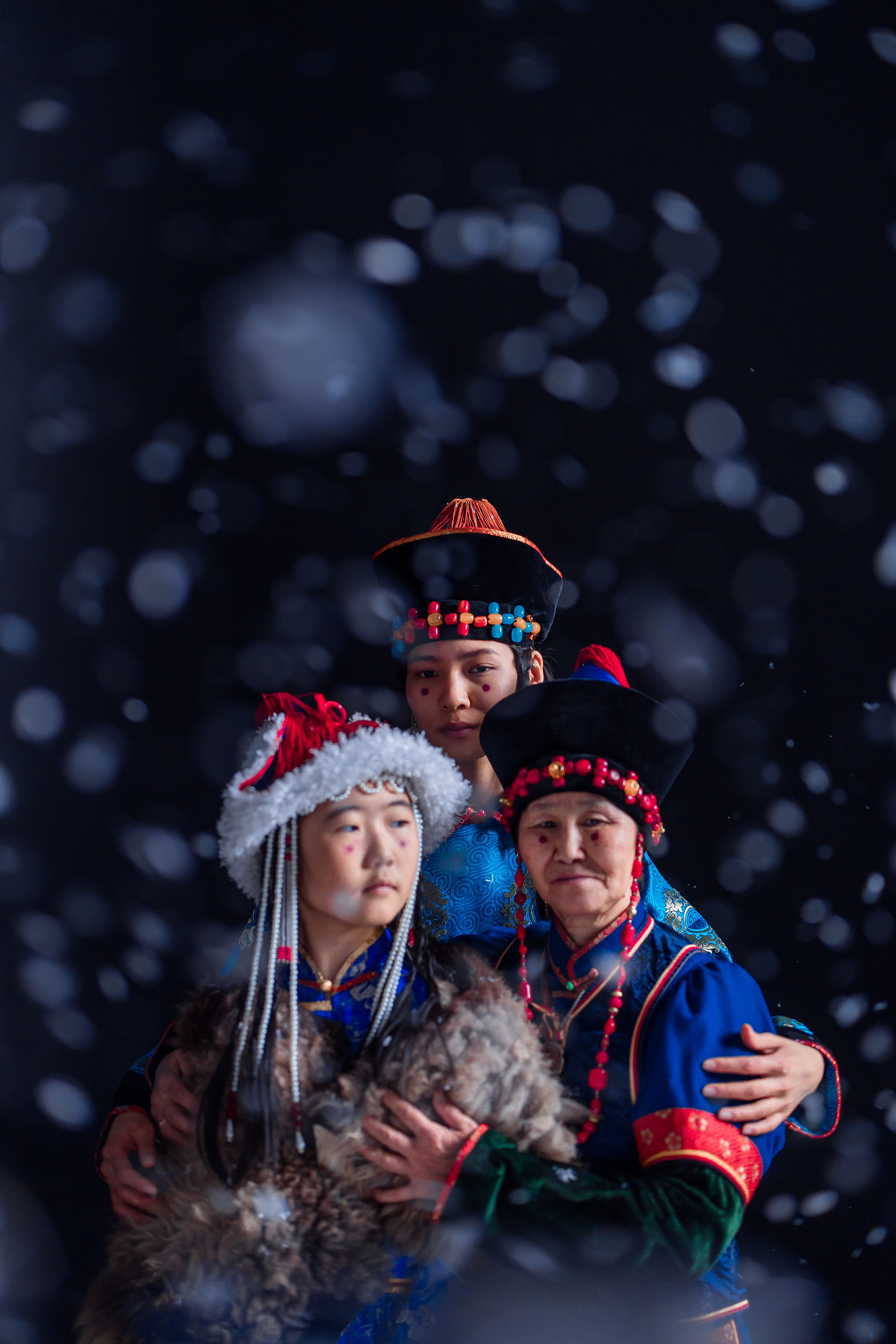 A Family Wearing Traditional Clothes Posing Together · Free Stock Photo