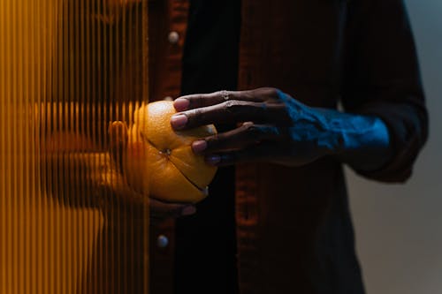 Person Holding Sliced Orange