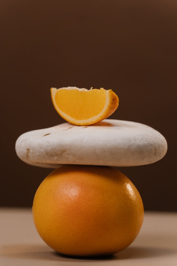 Orange Wedge On Top Of A Pebble