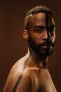 Topless Man With Black Beard