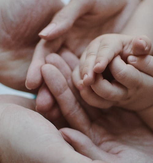 Free Person Holding Babys Feet Stock Photo