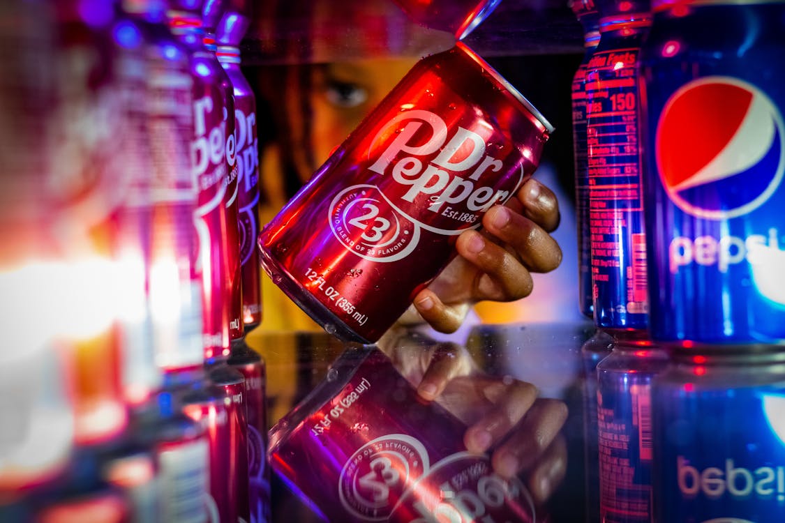 Free A Person Taking Out a Dr. Pepper Soda Stock Photo