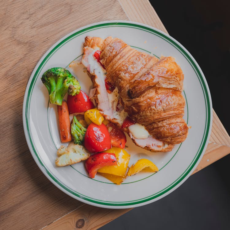 Roasted Vegetables And A Croissant With Bacon