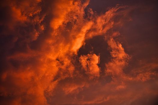 Vivid red and orange clouds create a dramatic sky during sunset in Podgorica.