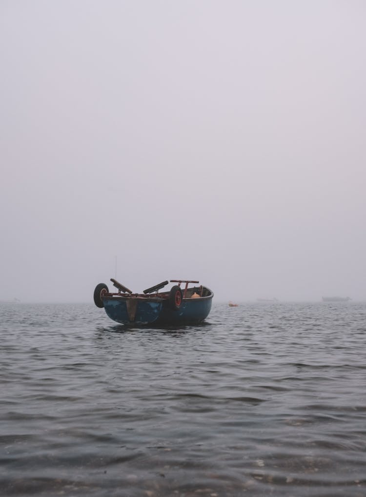 A Wooden Boat Anchored At Sea