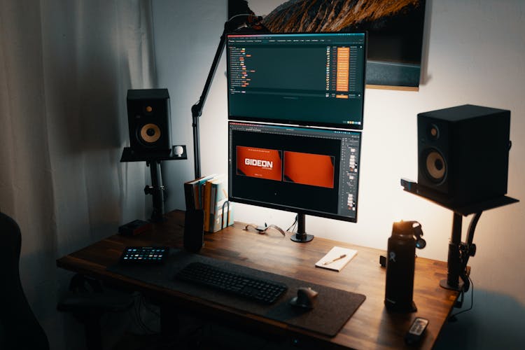 Computer And Speakers On Wooden Desk