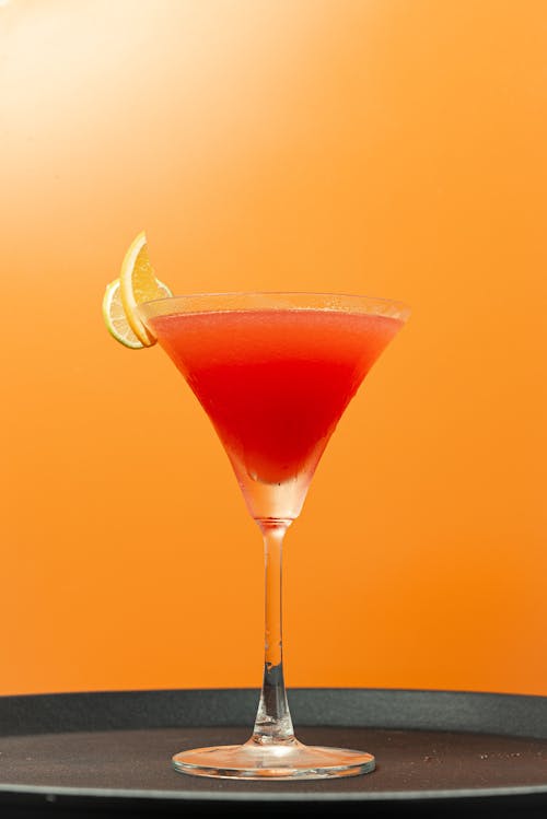 A Clear Martini Glass With Red Liquid