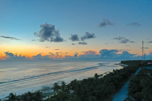 Aerial View of Ocean During Sunset