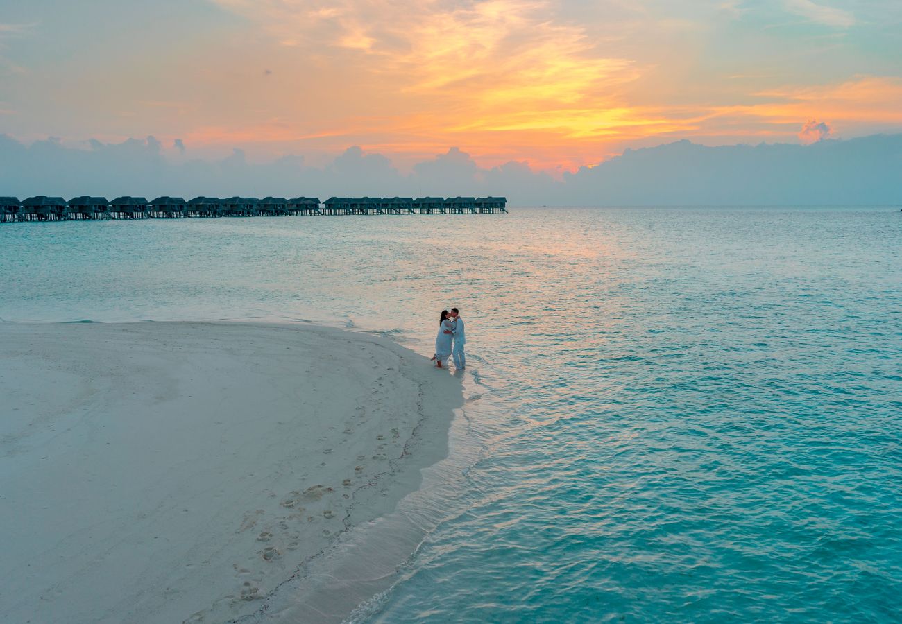 Couple on a sunset beach walk