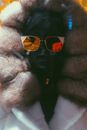 Woman in Black Sunglasses and White Fur Coat