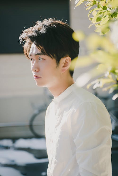 Selective Focus Photo of a Man in a White Button-Up Shirt