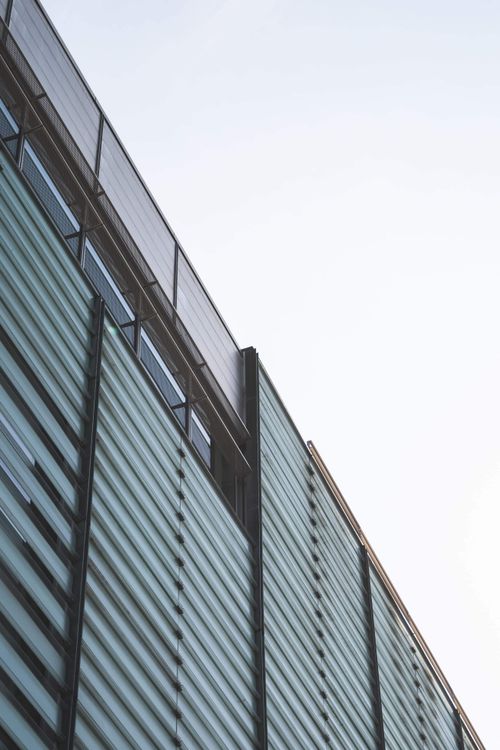 Free Dynamic low angle view of a modern glass facade in Montreal, showcasing urban architectural design. Stock Photo