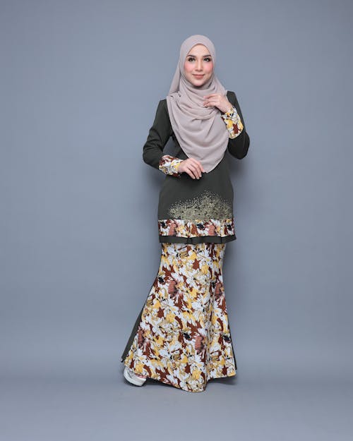 Woman in Beige Hijab and Green Floral Dress 