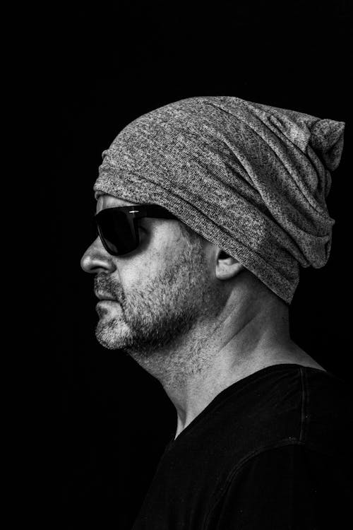 Monochrome Photo of a Man Wearing Sunglasses and a Beanie