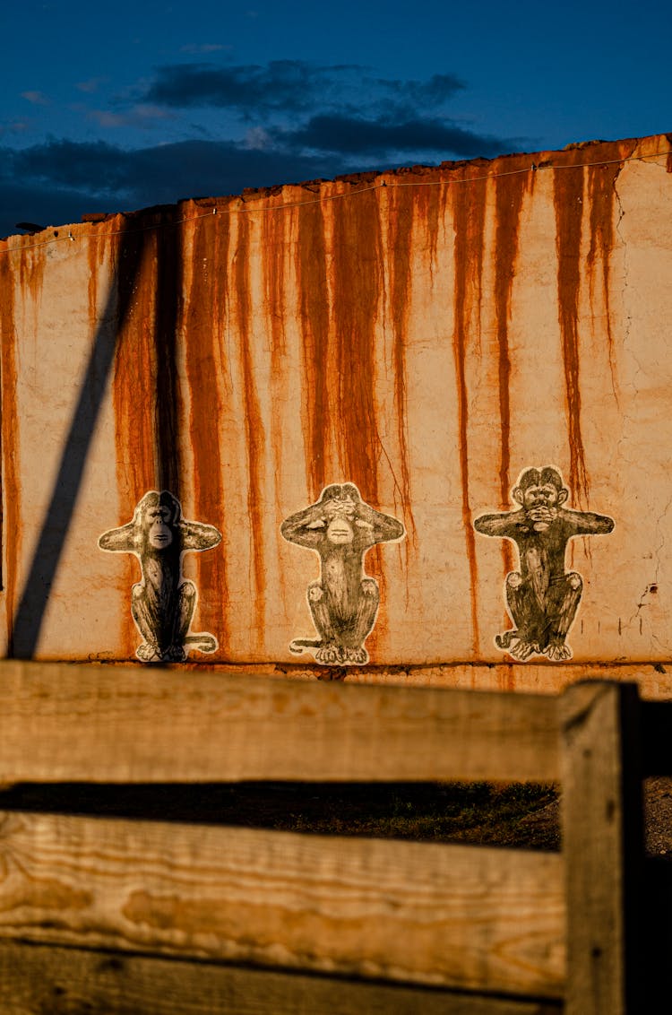 Monkey Stickers On A Rusty Wall