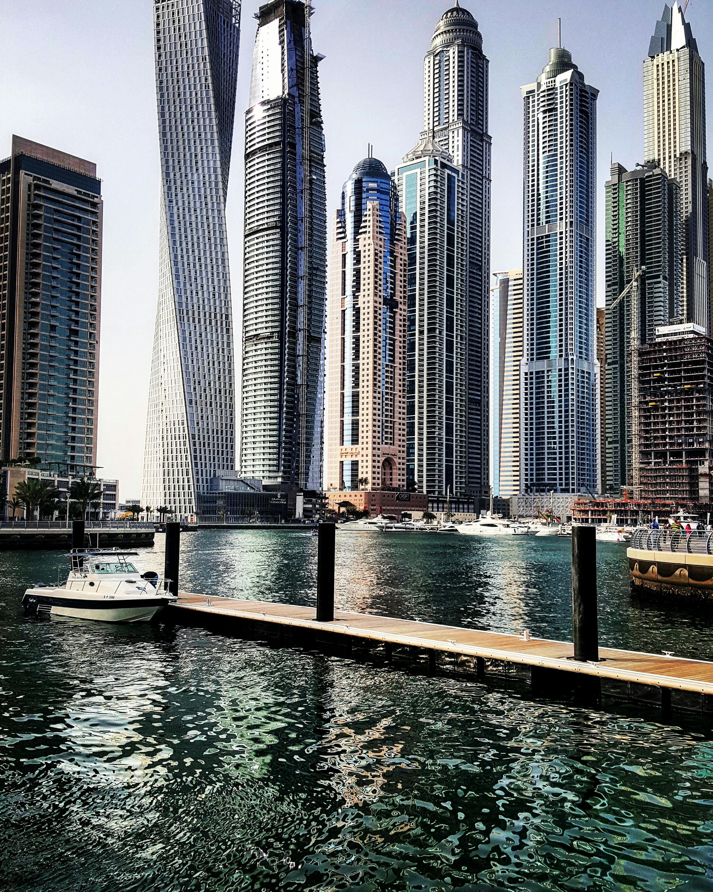 Flat lay of natural Japandi materials including light wood, linen, ceramic, and stone in warm neutral tones