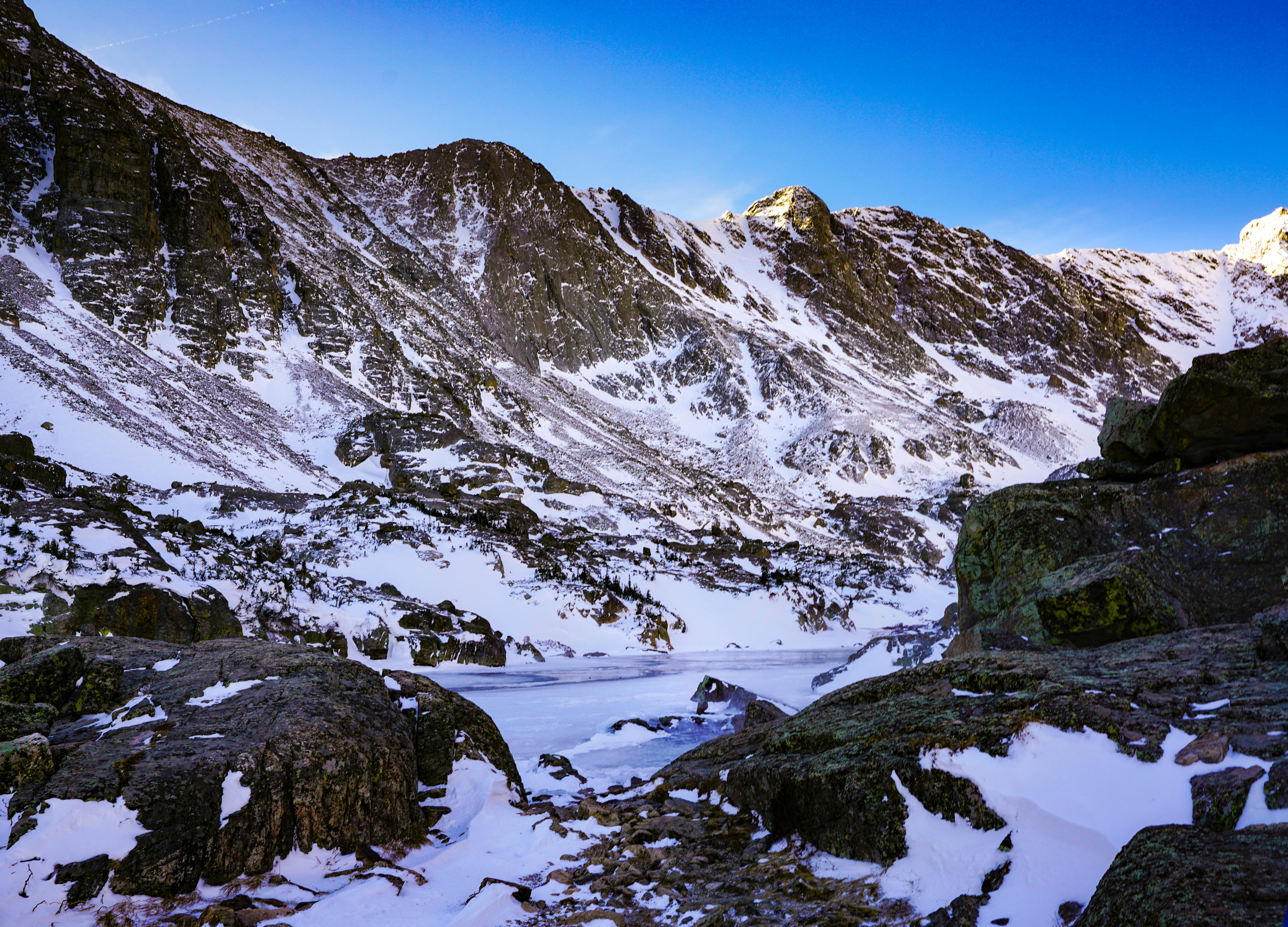 Prescription Goggle Inserts - Explore the stunning winter mountain landscape with icy peaks and clear blue sky.