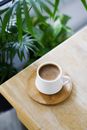 White Ceramic Mug on Brown Wooden Chopping Board