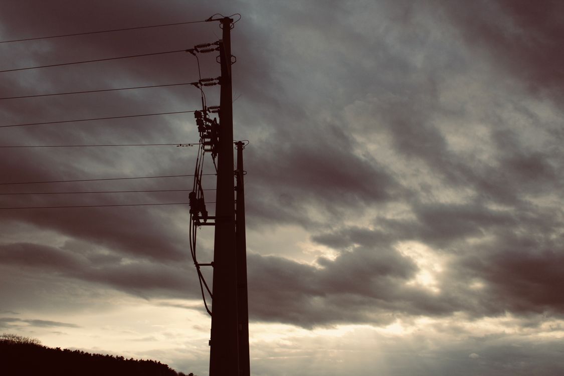 Electric Post Under Gray Sky · Free Stock Photo