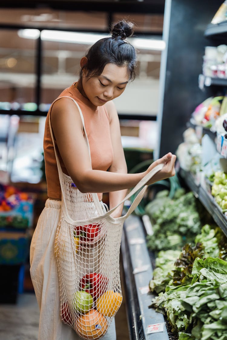 Woman Buying Groceries In A Supermarket