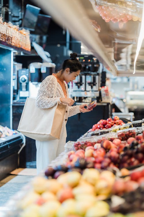 Free Woman Buying Groceries in a Supermarket Stock Photo