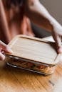 A Person Holding the Lid of a Food Container