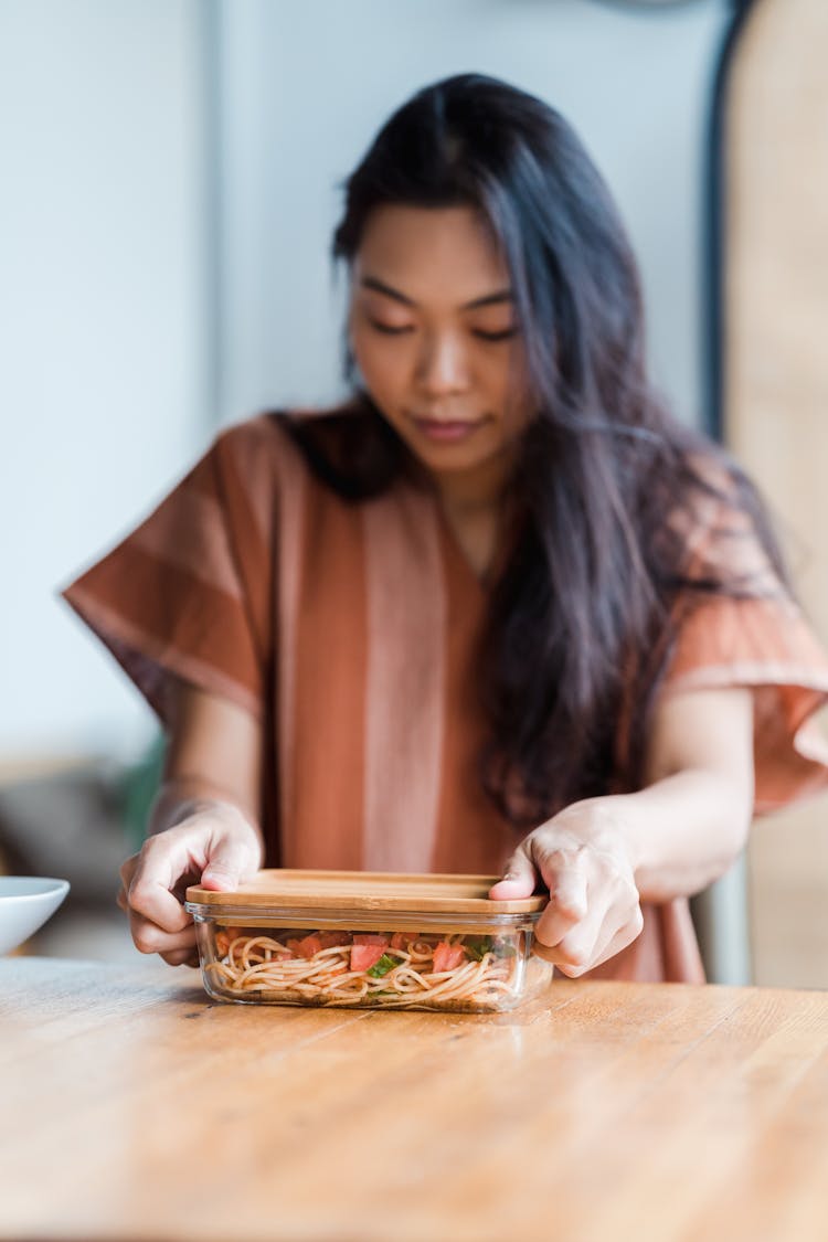 Woman Holding A Food Container